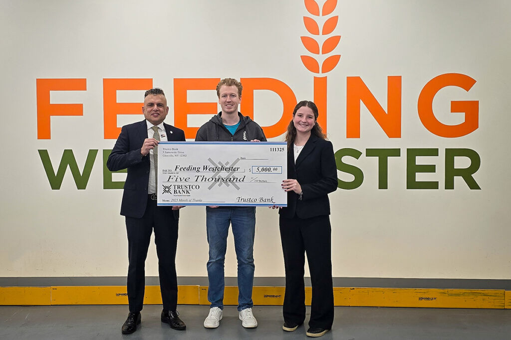 Feeding Westchester presented with a check as part of Trust Bank's month of thanks